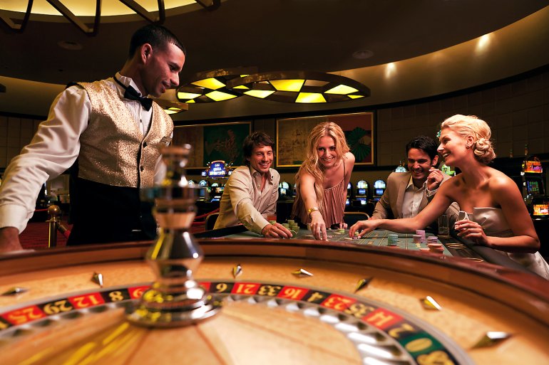 Players place bets in casino roulette