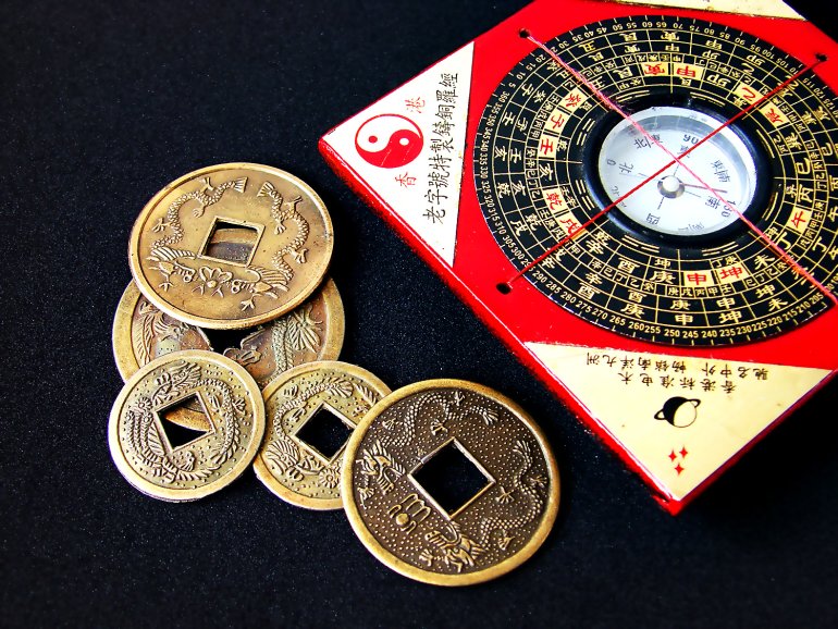 Feng-shui compass and runes to attract luck in gambling