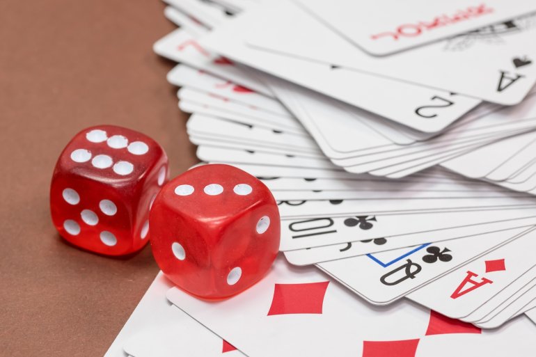 Red dice and playing cards