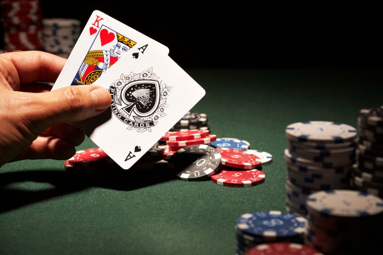 The King of Hearts and Ace of Spades are on hand in the blackjack game