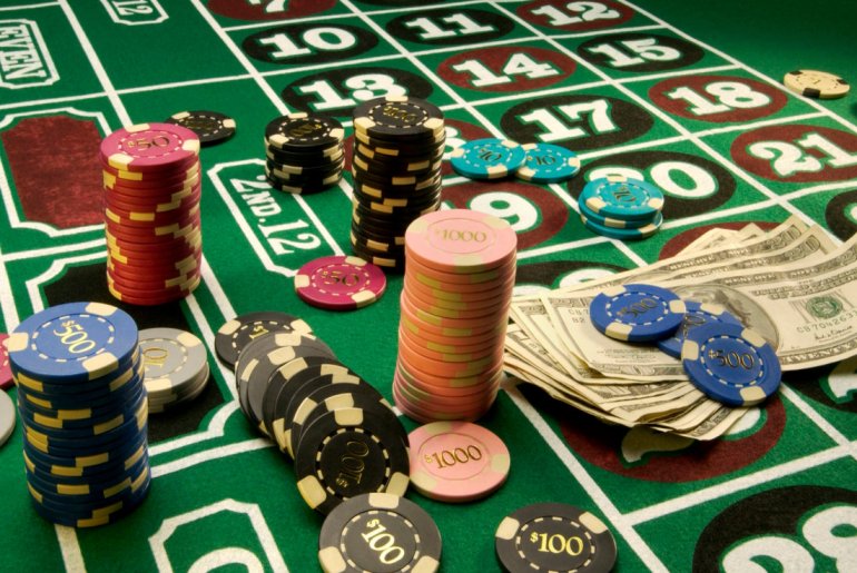Chips and cash at casino roulette