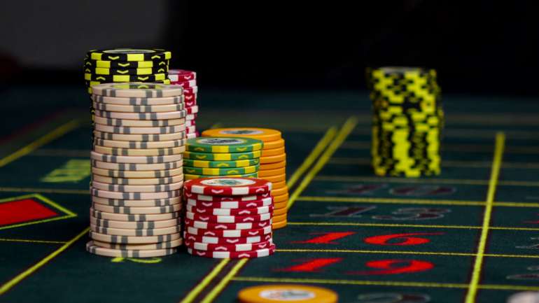 Game tokens on the roulette table in Incorrect Bet Casino chips in Incorrect Bet