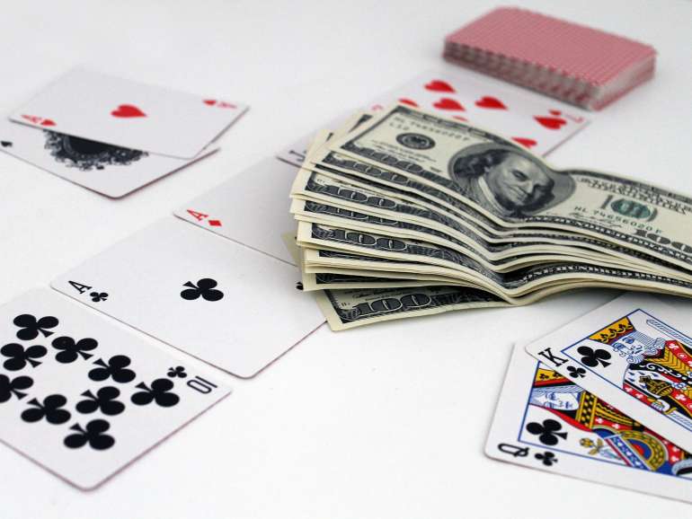 Cards and banknotes on the casino table in Change Cards in Change