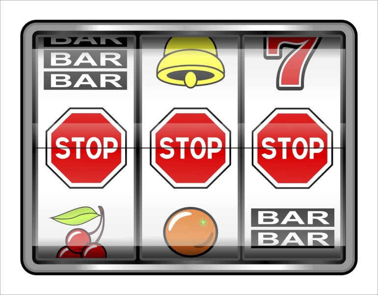 Three stop signs fall out on a slot