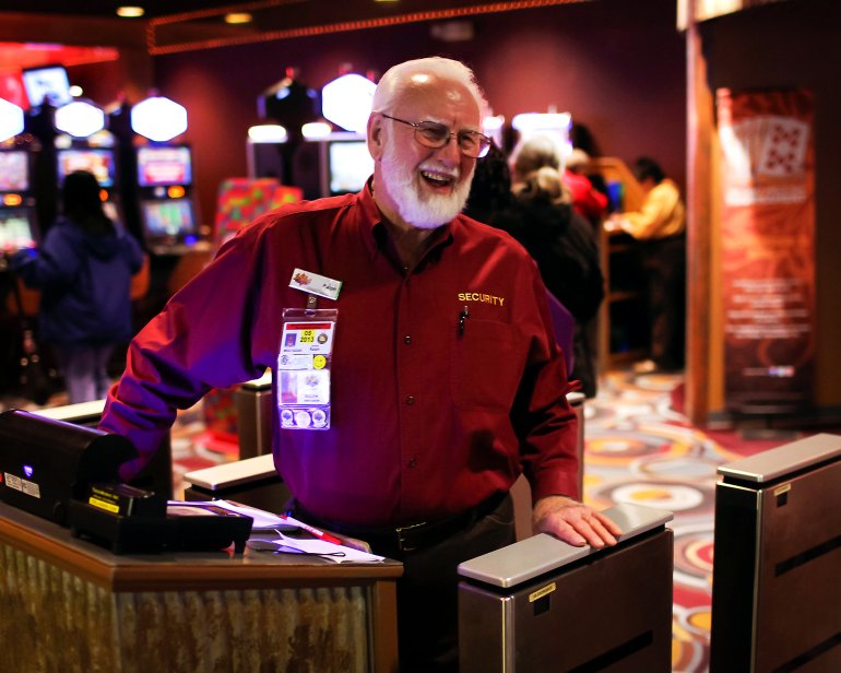Two security officers at casino slot machines